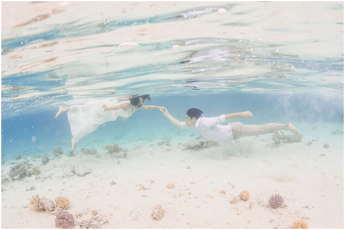 Fiji Underwater Portrait Session Bride & Groom holding hands