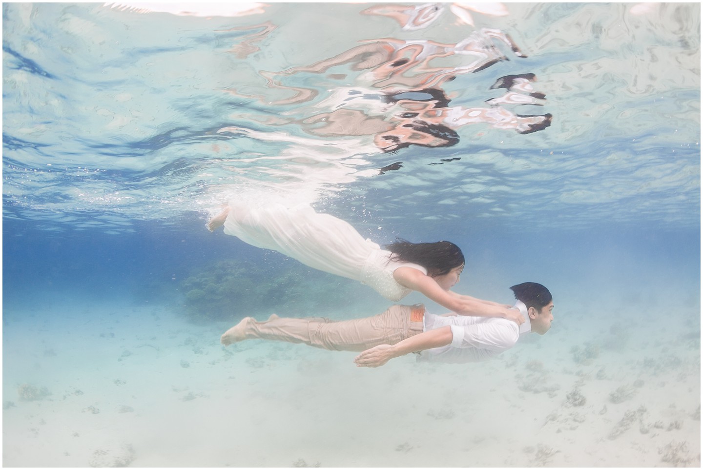Fiji Underwater Portrait Session Bride & Groom swimming