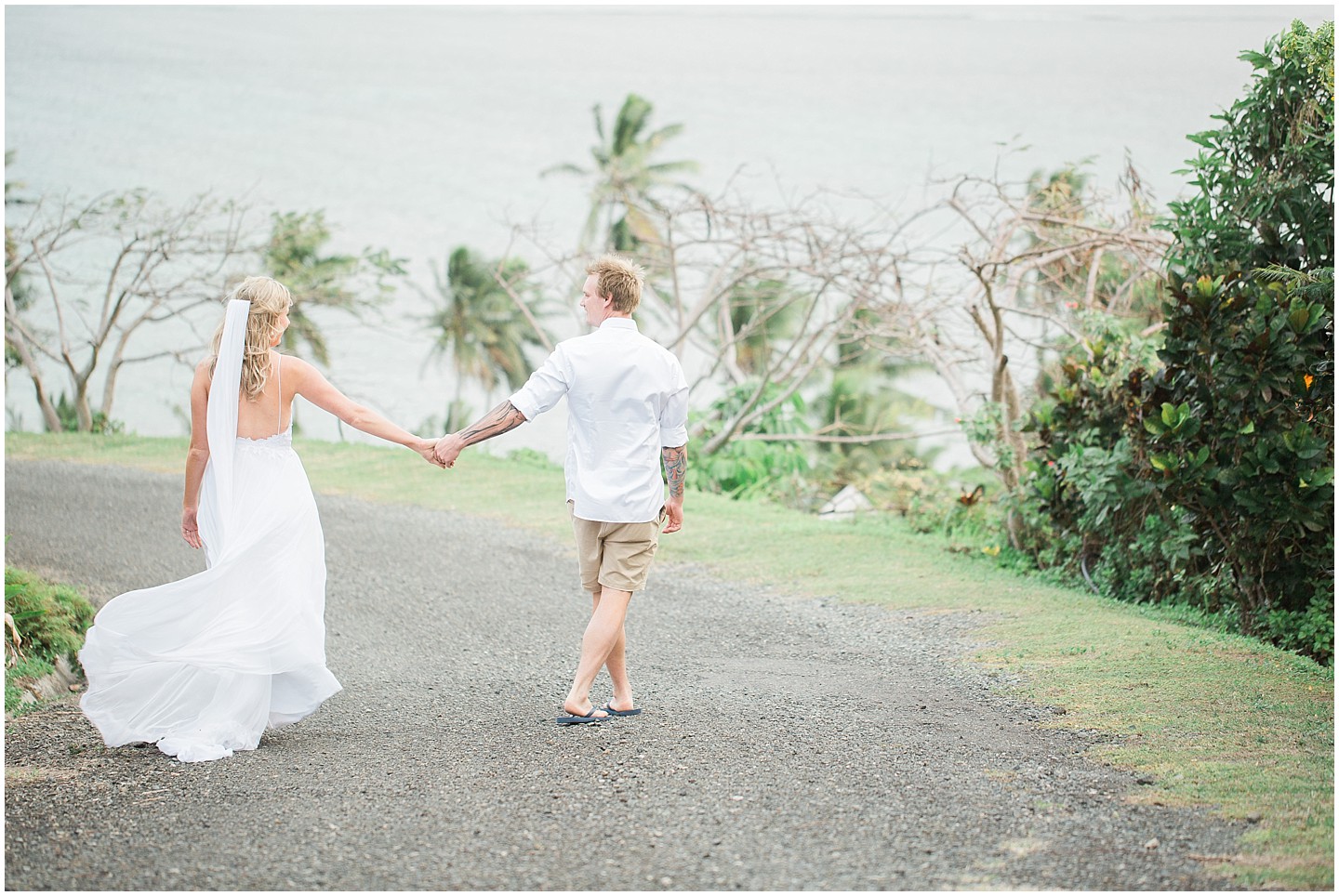 Outrigger Fiji Wedding bride and groom walking